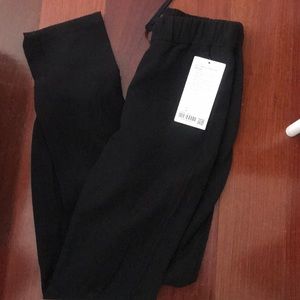 Never been worn, Lululemon on the fly pant TALL